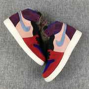 Overhead view of the pair showing light blue side logos, pink panels, purple heel sections, and furry collars.