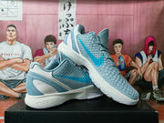 Angled view of the pair highlighting the textured side panels, blue detailing, sculpted white midsoles, and translucent heel sections.