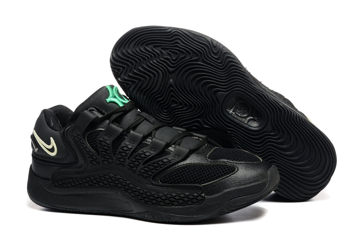 Black Nike KD18 sneaker pair with a green tongue detail and patterned black outsole; caption lists sizes 36-46 and style code IB3874-001.
