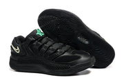Black Nike KD18 sneaker pair with a green tongue detail and patterned black outsole; caption lists sizes 36-46 and style code IB3874-001.