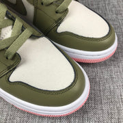 Close-up of the white textile toe boxes, olive overlays, and stitching.