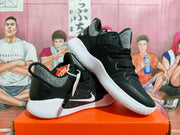 Black Nike basketball shoes with gray patterned panels and white soles, shown from the side.