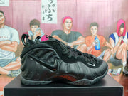 Side view of a black Foamposite-style sneaker with a molded upper and contrasting Swoosh details