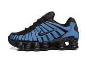 Side view of a blue and black Nike Shox-style sneaker.