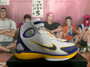 Side view showing the layered white upper, contrasting Swoosh, ankle strap, and yellow outsole.
