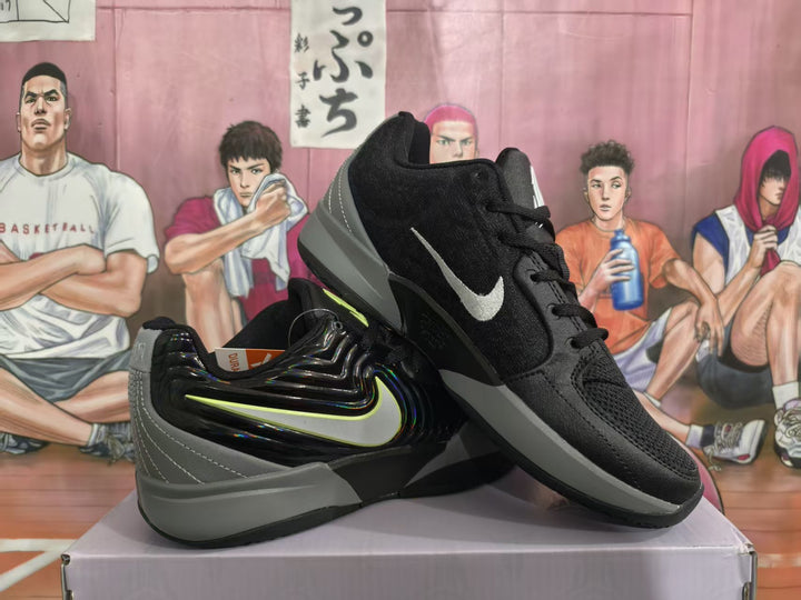 Black and grey basketball sneakers displayed on a shoebox, showing the side mark, grey heel section, and sculpted outsole.