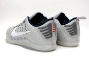 Rear three-quarter view showing navy collars and heel details on gray Nike Kobe 11 shoes