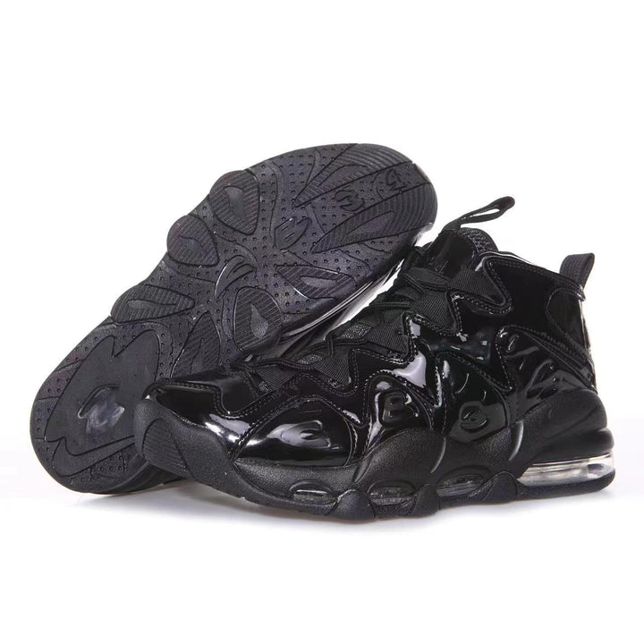 Pair of black glossy high-top sneakers shown from the side, with one shoe displaying the textured outsole.
