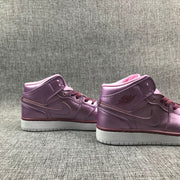 Pair of pink rose and burgundy high-top sneakers shown from the side.