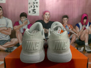Rear view showing Nike branding on the heels and the layered ribbed soles.