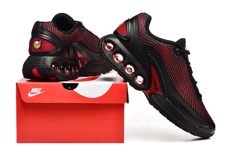 Black and red Nike Air Max sneakers shown with a shoebox