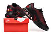 Black and red Nike Air Max sneakers shown with a shoebox