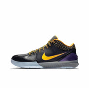 Black Kobe 4 basketball sneaker with gold side mark, gold laces and purple heel detail.