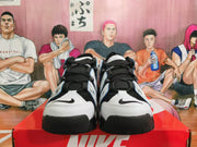 Front view of black-and-white Nike high-top sneakers with black laces and contrasting toe panels.
