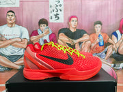 Side view of a red Nike basketball sneaker with a textured upper, black swoosh, neon laces, and translucent heel detailing.