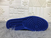 Underside view showing the blue rubber outsole and circular traction pattern.