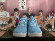 Front view of blue textured Nike Kobe basketball shoes with matching laces