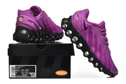 Purple Nike Air Max DN 8 sneakers shown from the side and rear on a shoebox; the box label shows a sample size.