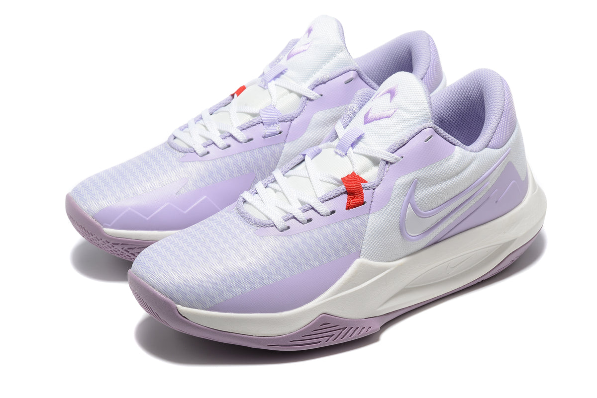 Pair of white and light purple low-top basketball shoes with a patterned outsole.
