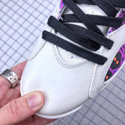 Close-up of the white toe area and black flat laces.