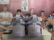 Rear view of purple and light gray Nike sneakers showing the “CHAPTER ONE” heel detail and pull tabs.
