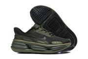 Nike olive and black running shoes shown from the side and outsole.
