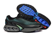 Black and turquoise sneakers shown with the blue-accented outsole exposed