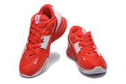 Red and white Nike Kyrie basketball shoes shown from the front
