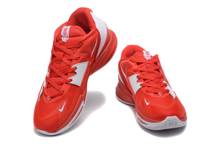 Red and white Nike Kyrie basketball shoes shown from the front