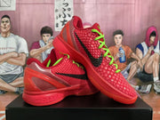 Angled view of red Nike Zoom basketball sneakers with textured uppers, black side branding and bright green laces.