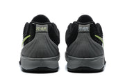 Rear view of the black sneakers showing gray heel panels, stitched detailing, and Jordan branding.
