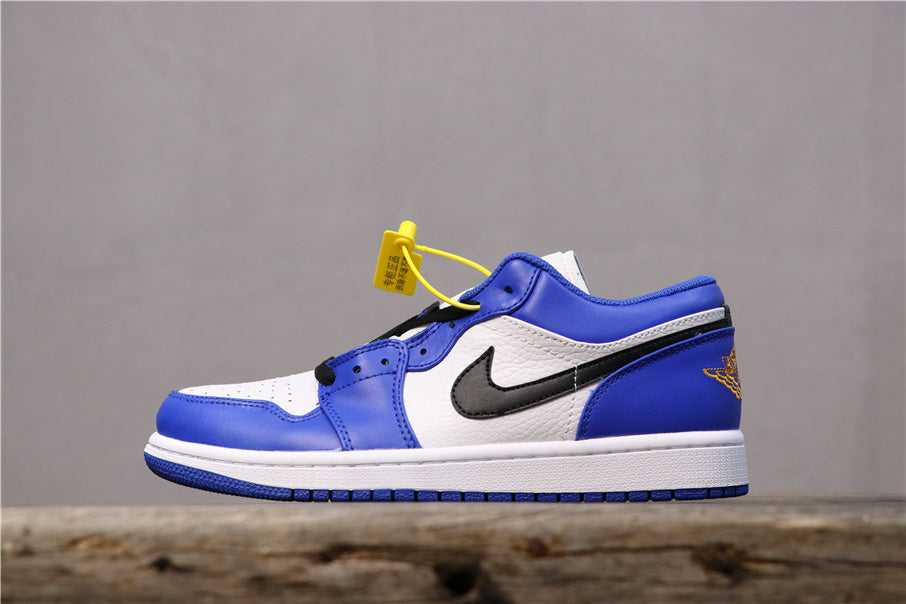 Side view of blue, white, and black low-top sneakers with a black side Swoosh-style mark, white midsole, blue outsole, and winged-ball branding near the heel.