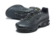 Pair of black Nike Air Max Plus sneakers shown from angled top and side views.