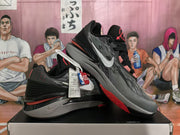 Pair of Nike GT Cut shoes showing the striped uppers and side profile
