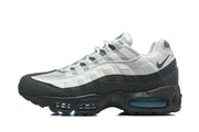 Side view of Nike Air Max 95 TT sneakers in white and dark grey with teal accents