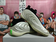 Basketball shoes shown from the side and underside, with sculpted cream panels and green heel details.