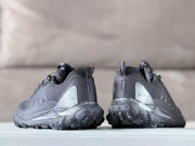 Rear view of black Alo sneakers showing the heel pull tabs, rear panels, branding, and outsole tread.
