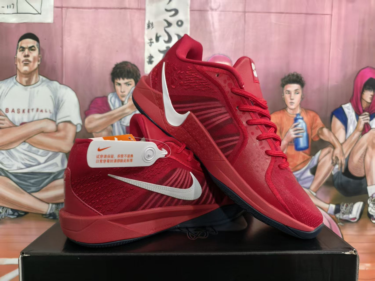 Pair of red Nike basketball sneakers shown from the side on a black box, with light-colored Swoosh logos and a basketball-themed background.