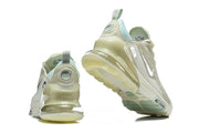 Rear and outsole views of pale green Nike Air Max 270 Premium sneakers.