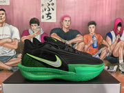 Side profile showing the silver Nike Swoosh, black upper, and green sole.