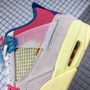 Close-up of the side showing the translucent pink panel, yellow mesh, and layered cream overlays.