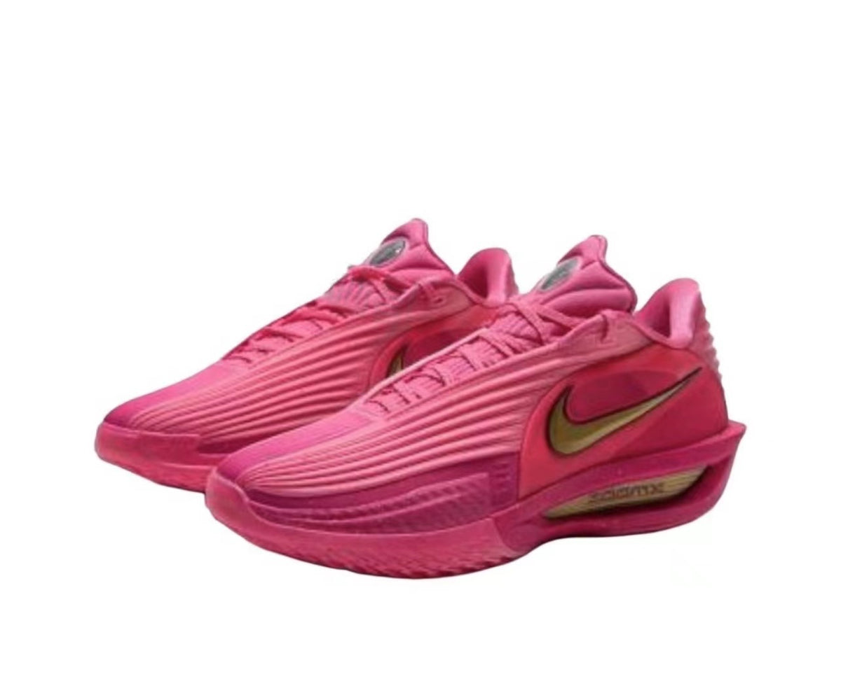Pair of pink Nike low-top sneakers showing ribbed upper detailing, gold side Swooshes, and sculpted soles.