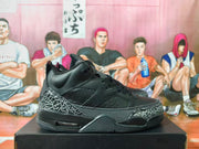 Side view of a black Jordan sneaker showing perforated panels, elephant-print accents, and a visible heel air unit