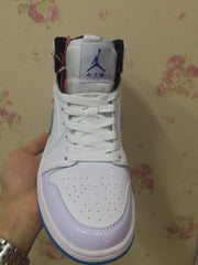 Top-front view showing the perforated toe box, white laces, and padded tongue.