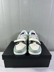 Front view showing perforated toe boxes, white laces, and adjustable forefoot straps.