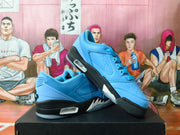 Angled side view showing the blue perforated upper, black midsole, and visible side window.