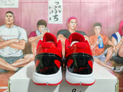 Rear view of the pair showing glossy black heel sections, red accents, and white midsoles.