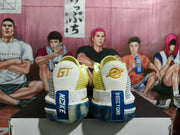 Rear view of white and lime Nike basketball sneakers with gold heel details, blue accents, and a translucent outsole.