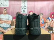 Rear view of a pair of black Jordan high-top sneakers showing Jordan branding and raised number 23 heel details.