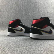 Rear-side view showing the contrasting red collar, black heel, white panels, and purple-yellow side detail.